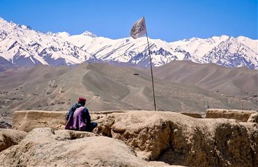 afghanistan mountain with taliban flag.jpg